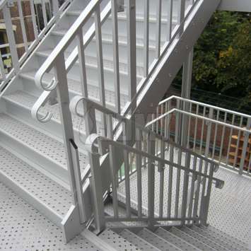 Stair handrails Handrails for both children and adults, mounted on the same evacuation stair.